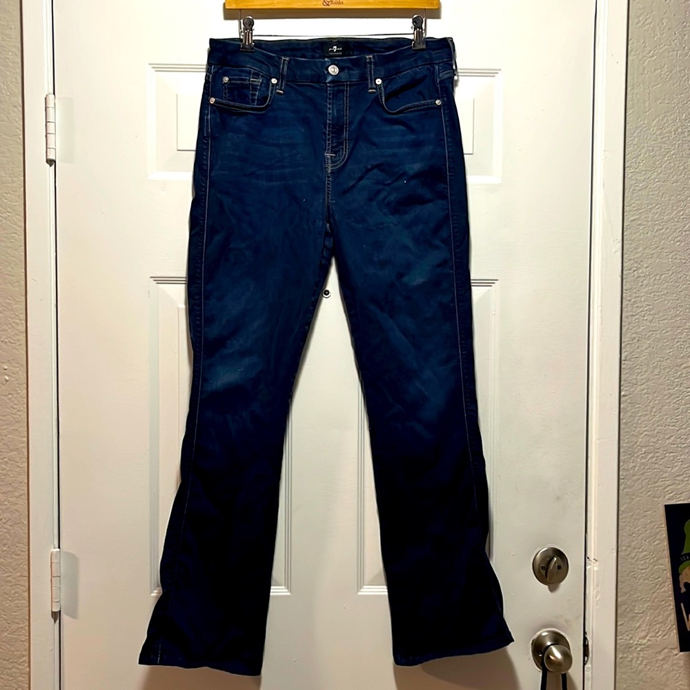 Woman’s dark denim 7 For All Mankind Jeans.